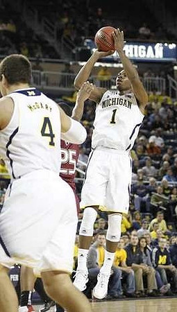 Mitch McGary (4) and Glenn Robinson III (1)