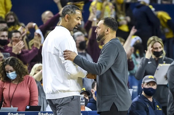 Juwan Howard and Minnesota Head Coach Ben Johnson