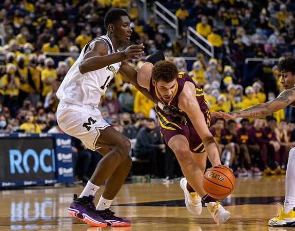 Moussa Diabate (14) and Eli Brooks (55)