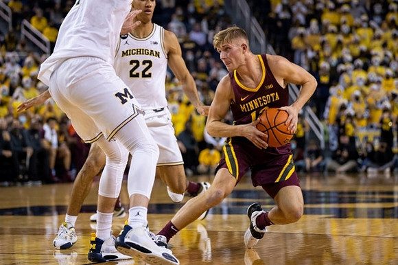 Hunter Dickinson (1) and Caleb Houstan (22)