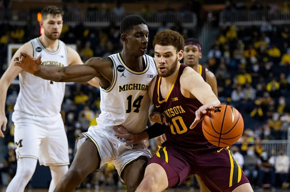 Hunter Dickinson (1) and Moussa Diabate (14)