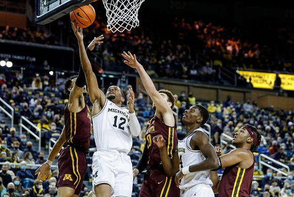 DeVante' Jones (12) and Moussa Diabate (14)