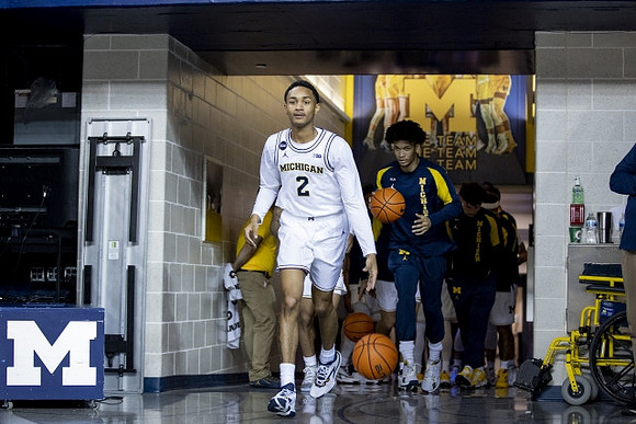 Kobe Bufkin (2) and Michigan Team