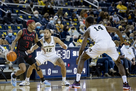 DeVante' Jones (12) and Moussa Diabate (14)