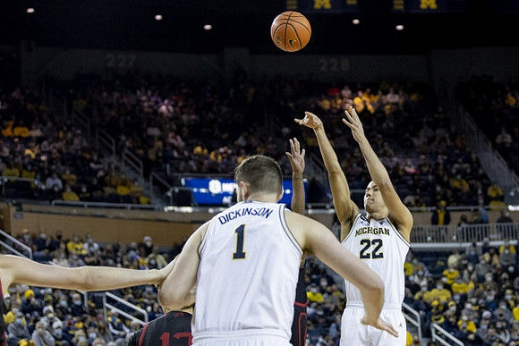 Hunter Dickinson (1) and Caleb Houstan (22)