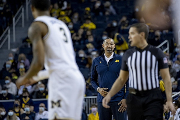 Zeb Jackson (3) and Juwan Howard