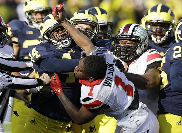 Delano Hill (44) and Dymonte Thomas (25)
