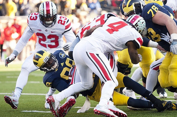 Devin Gardner (98) and Erik Magnuson (78)