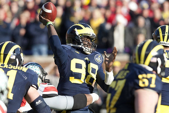 Graham Glasgow (61), Devin Gardner (98), and Kyle Kalis (67)