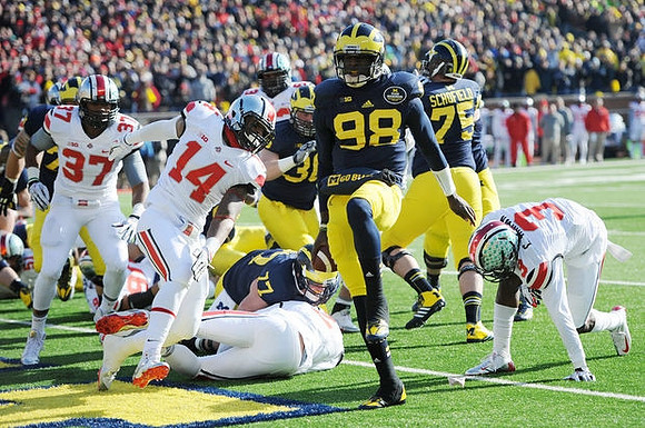 Taylor Lewan (77), Devin Gardner (98), Joe Kerridge (36), and Michael Schofield (75)