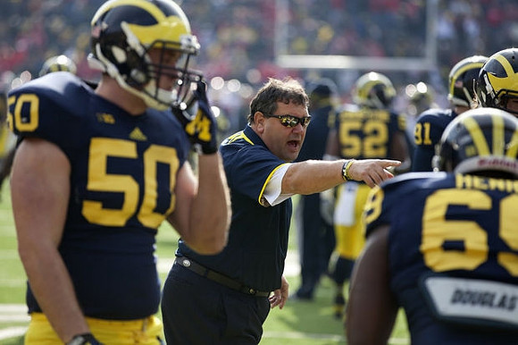 Tom Strobel (50), Brady Hoke, and Willie Henry (69)