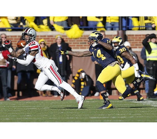 Josh Furman (14) and Thomas Gordon (30)
