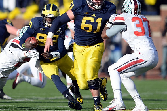Devin Gardner (98) and Graham Glasgow (61)