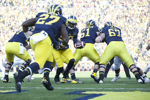 Taylor Lewan (77), Derrick Green (27), Devin Gardner (98), Graham Glasgow (61), and Kyle Kalis (67)