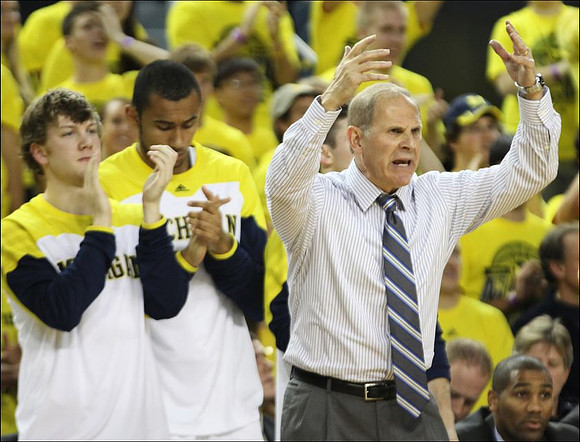 Matt Vogrich (13), Jon Horford (15), and John Beilein