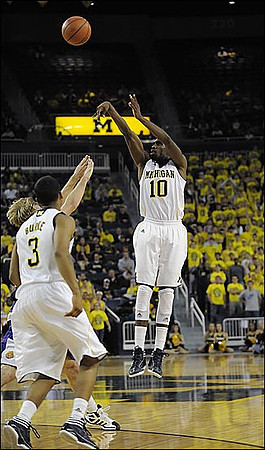 Trey Burke (3) and Tim Hardaway Jr. (10)