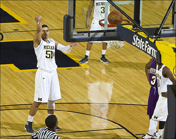 Jordan Morgan (52), Tim Hardaway Jr. (10), and Trey Burke (3)