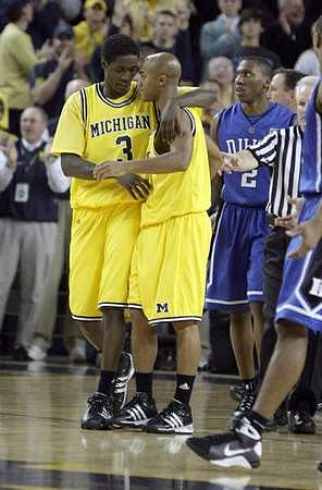 Manny Harris (3) and C.J. Lee (2)