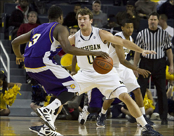 Zack Novak (0) and Trey Burke (3)