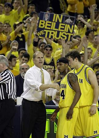 John Beilein, Kelvin Grady (44), and Zack Novak (0)