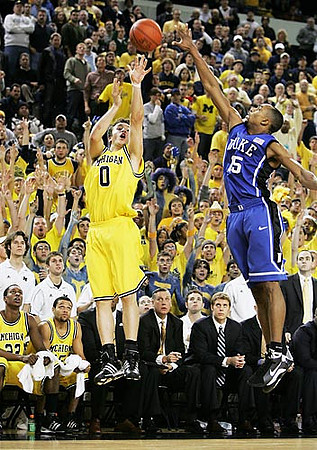 Zack Novak (0), Jevohn Shepherd (22), and David Merritt (15)