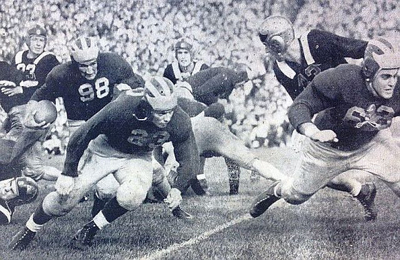 1940 Season-Michigan State: Tom Harmon (98), David Nelson (23), and Ralph Fritz (63)