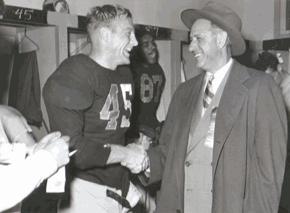 1947 Season-Southern California: Peter Elliott (45), Fritz Crisler, and Leonard Ford (87)