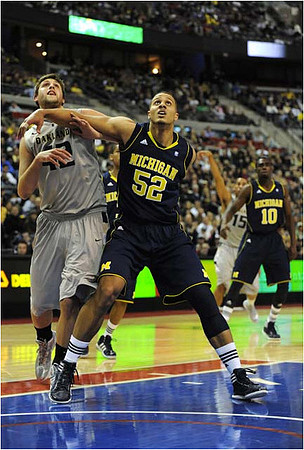 Jordan Morgan (52), Tim Hardaway Jr. (10), and Trey Burke (3)