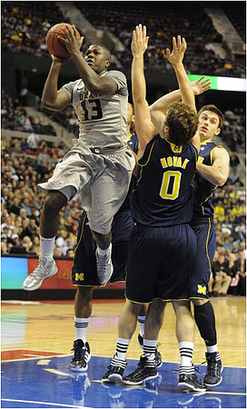Laval Lucas-Perry (13), Zack Novak (0), Stu Douglass (1), and Jon Horford (15)