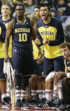 Tim Hardaway Jr. (10), Jon Horford (15), and Zack Novak (0)
