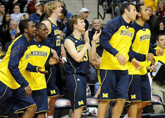 Corey Person (32), Trey Burke (3), Blake McLimans (22), Matt Vogrich (13), Josh Bartelstein (20), and Jon Horford (15)