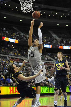 Zack Novak (0) and Evan Smotrycz (23)