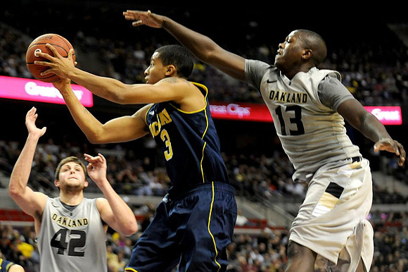 Trey Burke (3) and Laval Lucas-Perry (13)