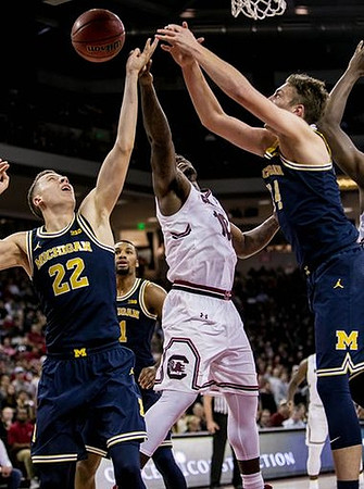 Duncan Robinson (22) and Mark Donnal (34)