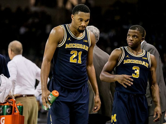 Zak Irvin (21) and Xavier Simpson (3)