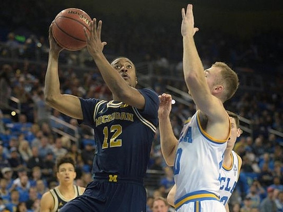 Muhammad-Ali Abdur-Rahkman (12) and D.J. Wilson (5)