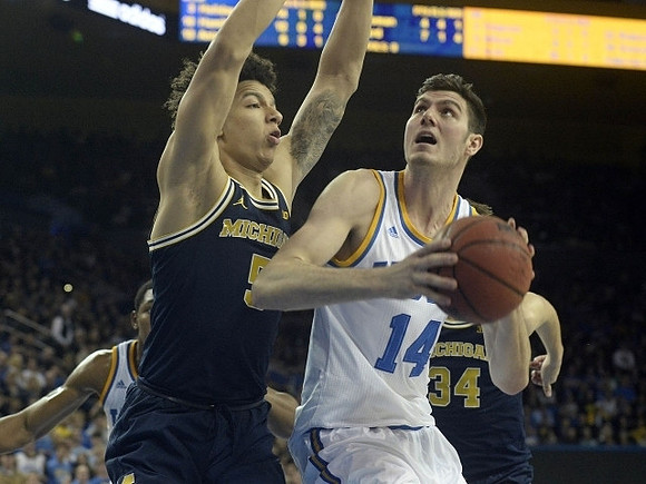 D.J. Wilson (5) and Mark Donnal (34)