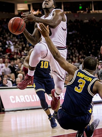 Derrick Walton Jr. (10) and Xavier Simpson (3)