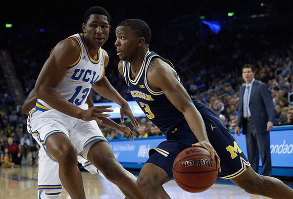 Xavier Simpson (3) and UCLA Head Coach Steve Alford