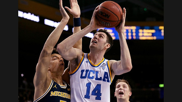 D.J. Wilson (5) and Mark Donnal (34)