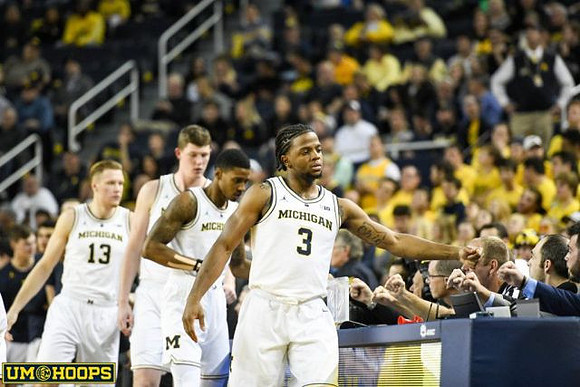 Ignas Brazdeikis (13), Jon Teske (15), Charles Matthews (1), and Zavier Simpson (3)