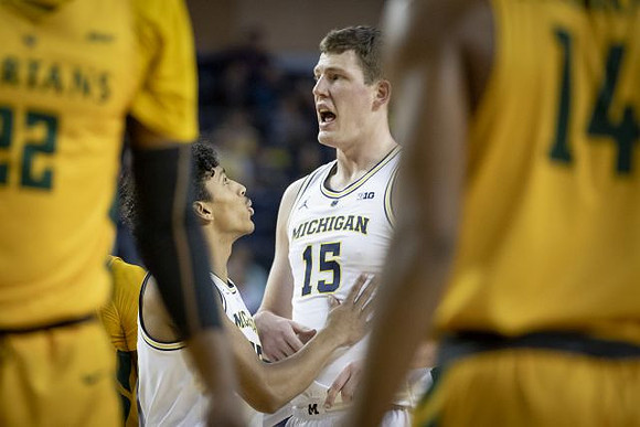 Eli Brooks (55) and Jon Teske (15)