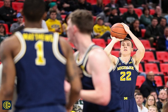 Charles Matthews (1), Jon Teske (15), and Duncan Robinson (22)