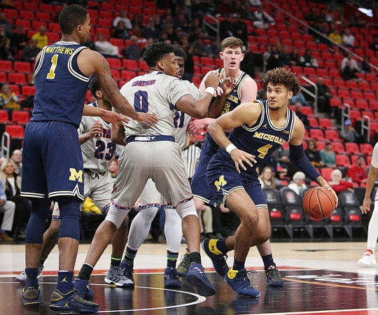 Charles Matthews (1), Jon Teske (15), and Isaiah Livers (4)
