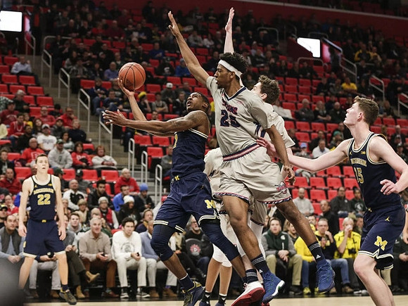 Duncan Robinson (22), Charles Matthews (1), and Jon Teske (15)
