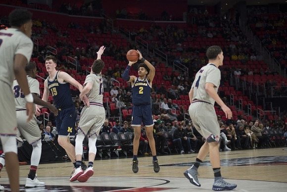 Jon Teske (15) and Jordan Poole (2)