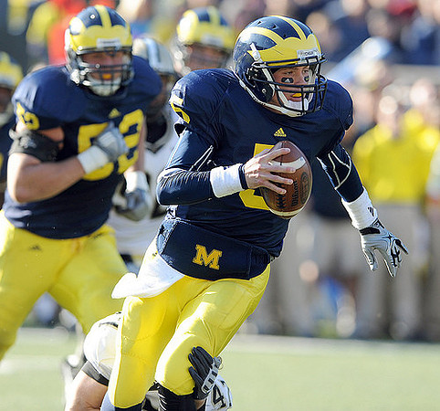 Tate Forcier (5) and Stephen Schilling (52)