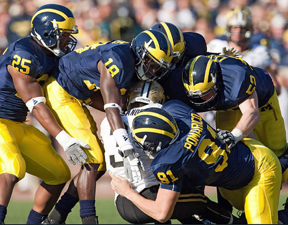Kenny Demens (25), James Rogers (18), Tom Pomarico (91), and Kevin Leach (52)