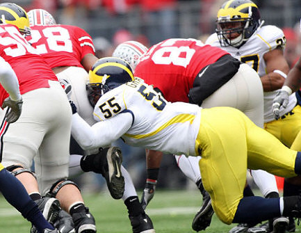 Brandon Graham (55) and Brandon Harrison (27)