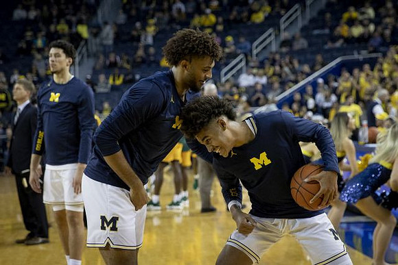 Brandon Johns Jr. (23), Isaiah Livers (4), and Jordan Poole (2)